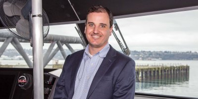 Alex Adams on bridge of Water Taxi