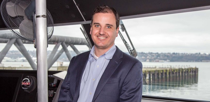 Alex Adams on bridge of Water Taxi