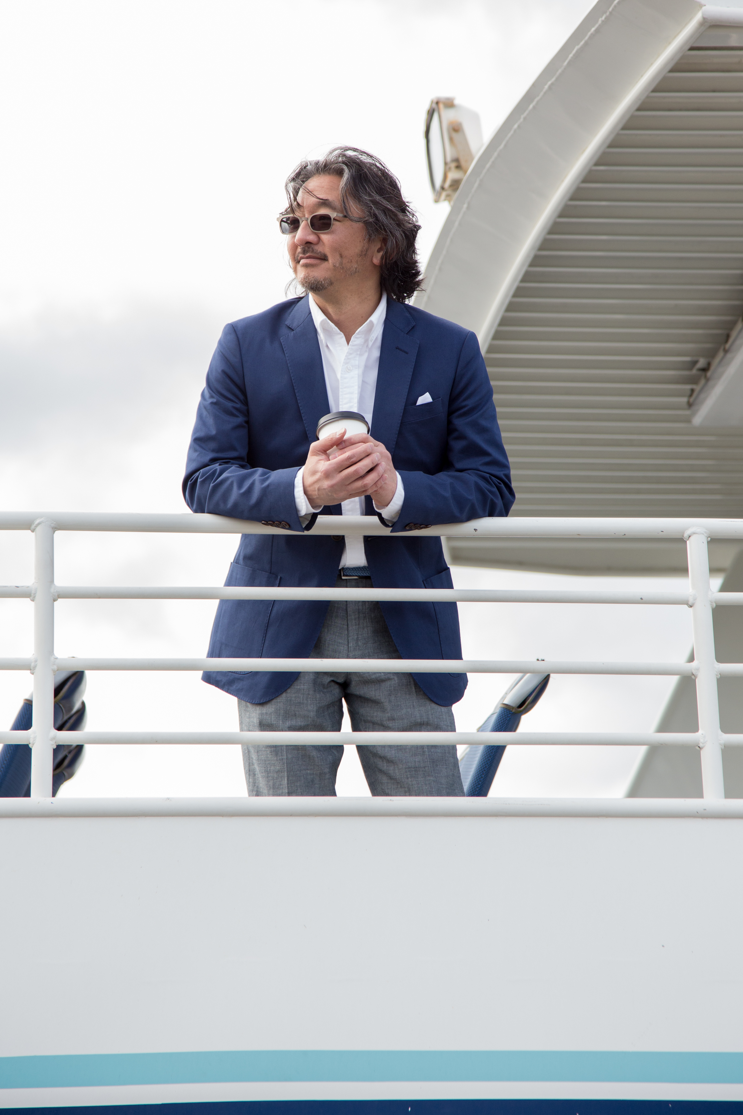 Department of Transportation Director Harold Taniguchi stands aboard a King County Water Taxi.