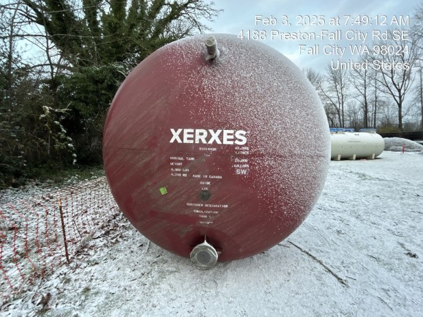 An image of the end of a red tank with the word "Xerxes" printed in white.