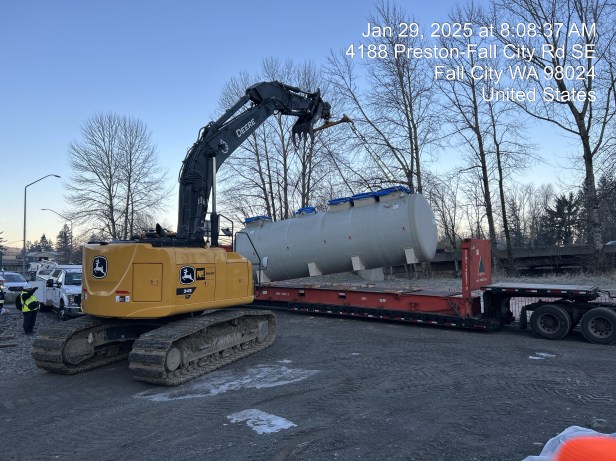 A crane lifts a tank as part of the Fall City On-Siote Septic project.
