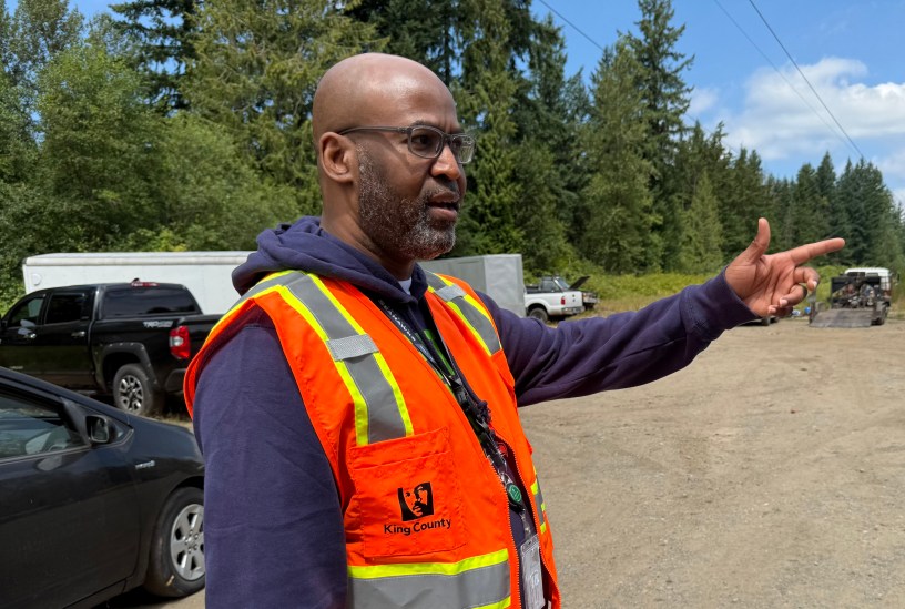 A King County employee points to his left