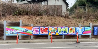 A brightly colored mural with the message "Welcome to Skyway" located along Renton Avenue S.